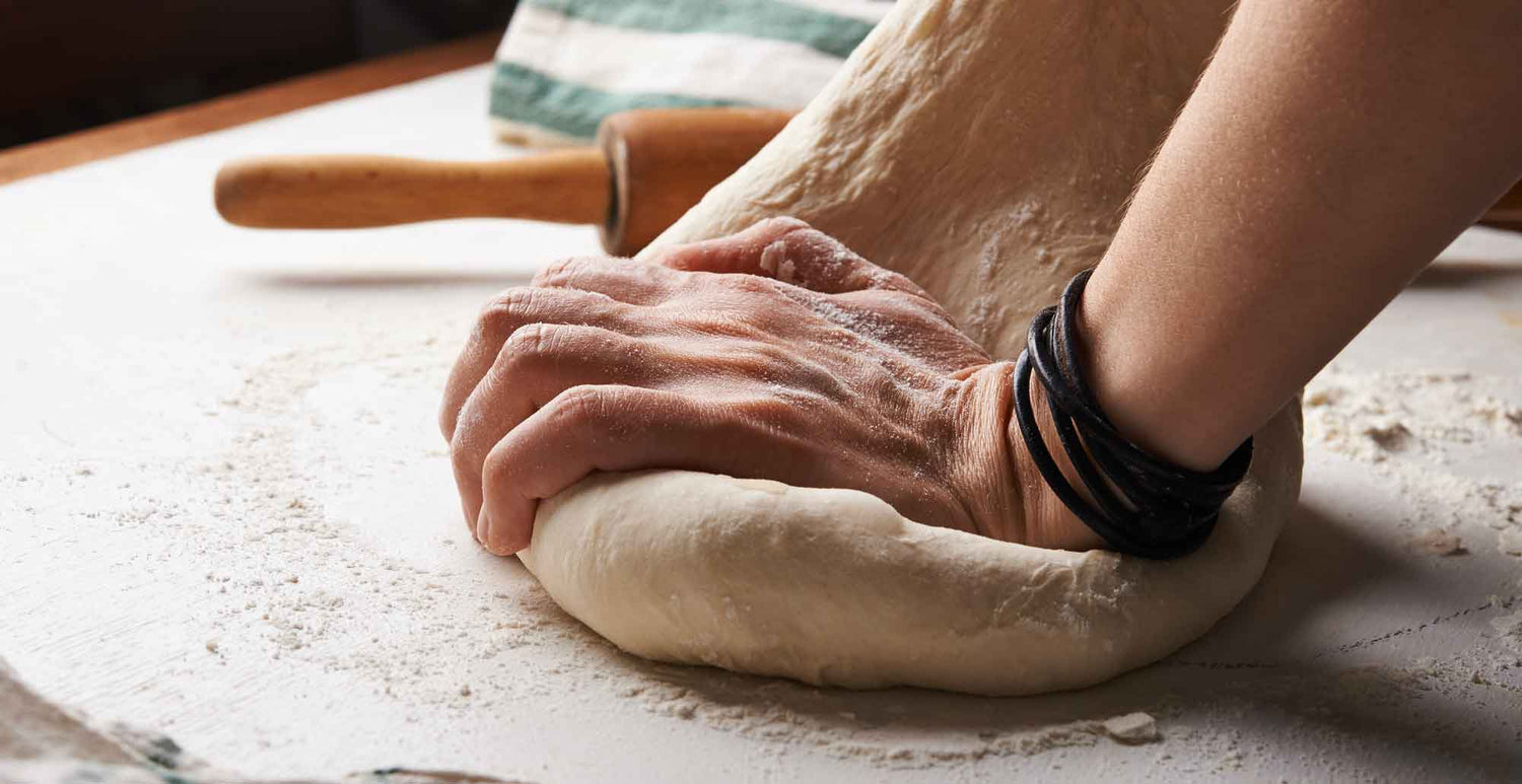 Image of kneading pizza dough shot by nadya-spetnitskaya-tOYiQxF9-Ys-unsplash