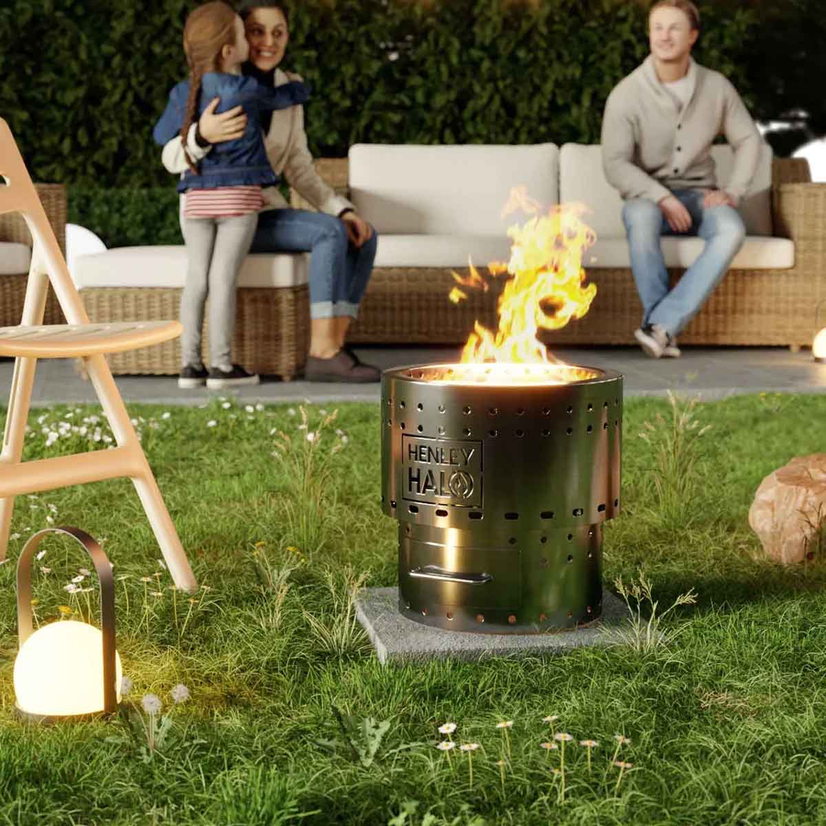 Halo firepit in the garde with a couple on an outdoor sofa