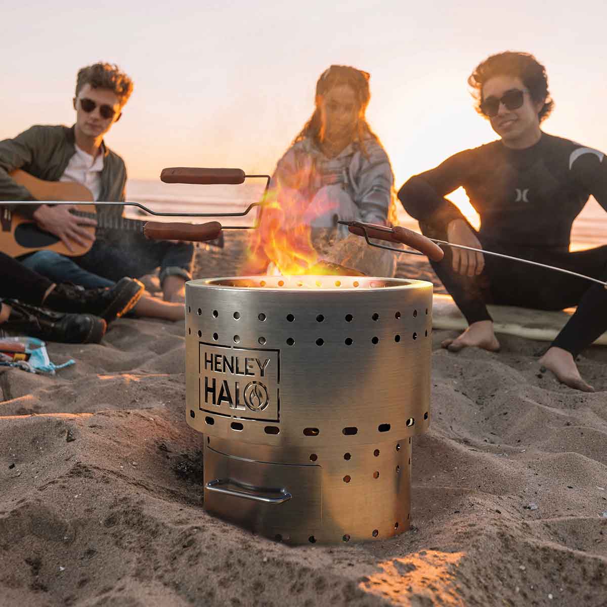 Lifestyle shot of people on the beach with the halo firepit